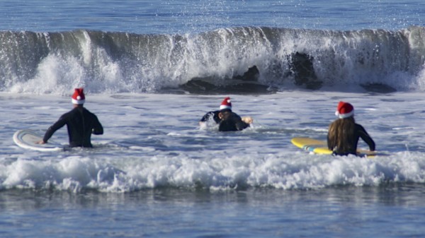 Santas go Surfing on Coronado Beach